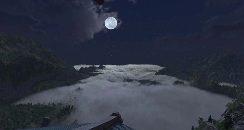 蓝天下月亮云层山峰